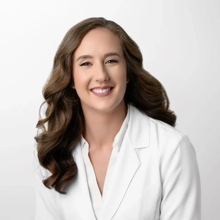 Dr. Eden Yelverton, a young woman with long brown hair smiling.