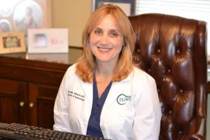 Dr. Christine Albrecht, a smiling woman with long dark blond hair.