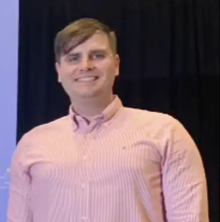 Dr. Zoltan Maronosi, a white male smiling, with brown hair.